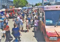  ?? STAFF FILE PHOTO ?? Chattanoog­a Market attendees shop the food choices at the 2019 Street Food Festival in the First Horizon Pavilion.