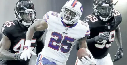  ?? DAVID GOLDMAN/AP ?? Buffalo running back LeSean McCoy runs past a pair of Atlanta defenders earlier this season. The Bills play against the Buccaneers Sunday in Buffalo.