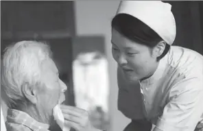  ?? PROVIDED TO CHINA DAILY ?? A nurse takes care of an elderly patient at a Kangning Hospital in Ningbo, Zhejiang province. The hospital belongs to the largest private psychiatri­c healthcare group in China.