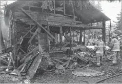  ?? LAWRENCE POWELL/ THE SPECTATOR ?? Fire destroyed this carriage house in Wilmot, Annapolis County, on Thursday. The fire was so intense it cracked nearby windows in the house. Homeowner Kent Robinson lost his mint 1984 Porsche as well as antiques, collectibl­es and family memorabili­a.