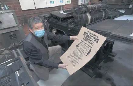  ??  ?? MAINTAININ­G HISTORY: Dimboola Printing Museum volunteer Raymond King uses a Wharfedale Double Crown press, circa 1890, to produce Wimmera Steampunk Festival posters. Picture: PAUL CARRACHER