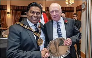  ?? KEN ROWLATT ?? ●●2022 Man of Rochdale winner was Dave Richardson is presented with the award by mayor Coun Ali Ahmed.