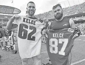  ?? AP FILE PHOTO BY ED ZURGA ?? Chiefs tight end Travis Kelce, left, and his brother, Eagles center Jason Kelce, exchange jerseys after a 2017 game.