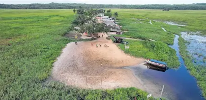  ?? ADRIANO MACHADO ■ REUTERS ?? A drone view shows the Uaha village on the Jumina indigenous land, near the mouth of the Amazon in Oiapoque, State of Amapa, Brazil, March 21.