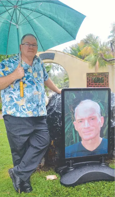  ?? Picture: JANESSA EKERT ?? MUCH-ADORED: Mark Morris farewells his brother, celebrity gardener Kim Morris, at a memorial service at the Cairns Chinese Friendship Garden.