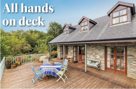  ??  ?? The raised deck at the property makes the most of views out over the acre of gardens and beyond towards Kenmare Bay, and is linked to the living area via French doors