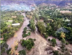  ?? VENTURA COUNTY SHERIFF’S OFFICE VIA AP ?? This photo provided by Ventura County Sheriff’s Office shows an arial view of Montecito with mudflow and debris due to heavy rains on Tuesday. Several homes were swept away before dawn Tuesday when mud and debris roared into neighborho­ods in Montecito...