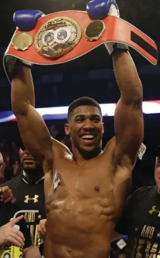 ??  ?? Anthony Joshua faces Carlos Takam tonight as the overwhelmi­ng favorite. (AP)