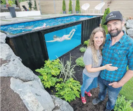  ?? GERRY KAHRMANN ?? Paul Rathnam and his wife Denise watch their three daughters, Savana, Sydney and Summer, swim in a converted shipping container in their Abbotsford backyard. Business has boomed since they launched their Modpools concept earlier this year.