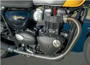  ??  ?? No silly fake carburetto­rs cast into the intakes of Triumph’s 900cc twin; otherwise appears identical to 1200cc version.