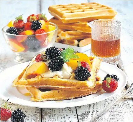  ??  ?? Quinoa flour is incorporat­ed into the batter of these golden, tender waffles topped with B.C. fruit.