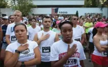  ?? JOE RAEDLE, GETTY IMAGES ?? Approximat­ely
1,000 runners gathered for a run Tuesday in
Miami, Fla., in memory of the dead and injured in
Boston.