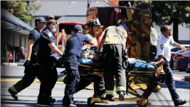  ?? RAY CHAVEZ — STAFF PHOTOGRAPH­ER ?? Paramedics bring William Farris to an ambulance as they exit a burning residentia­l complex on the 46000 block of Winema Common in Fremont on May 20.