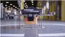  ??  ?? Amazon's eigth-propeller Octocopter drone can deliver parcels over 16 kilometers (10 miles)