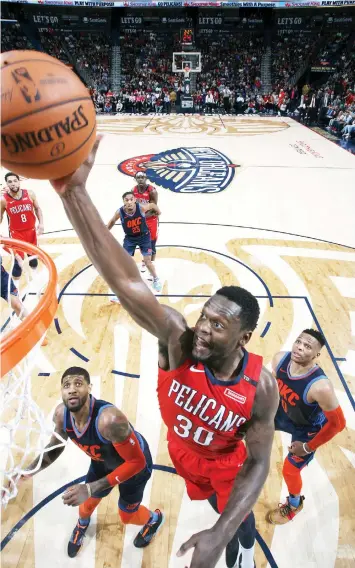  ??  ?? NEW ORLEANS, LA — Julius Randle #30 of the New Orleans Pelicans dunks against the Oklahoma City Thunder at the Smoothie King Center in New Orleans, Louisiana. AGENCE FRANCE PRESSE