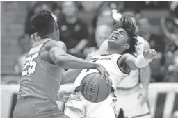  ?? JOE ROBBINS/GETTY IMAGES ?? Tyus Battle of Syracuse collides with Remy Martin of Arizona State during Wednesday’s game.