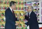  ?? THE ASSOCIATED PRESS ?? President George H. Bush, left, listens to Toys R Us Chairman Charles Lazarus, right, as he visits the toy chain’s second store to open in Japan. Lazarus, the World War II veteran who founded Toy R Us, has died at age 94.