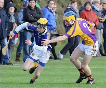  ??  ?? Stephen Kenny of Coláiste Bhríde trying to find a way past Mark Doyle (Wexford C.B.S.).