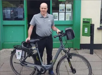  ??  ?? Minister for Environmen­t Denis Naughten and one of the ebikes.