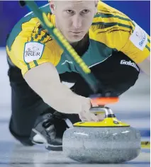  ??  JEFF MCINTOSH/THE CANADIAN PRESS ?? Northern Ontario skip Brad Jacobs lets a rock go as his team plays New Brunswick on Wednesday.