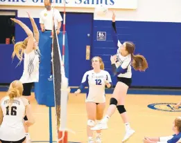  ??  ?? St. Mary’s Kyra Obert hits the ball over the net in game two against John Carroll on Thursday.