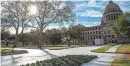  ?? LAUREN WITTE/CLARION LEDGER ?? Ice lines the roads and sidewalk in front of the Mississipp­i State Capitol on Jan. 16.