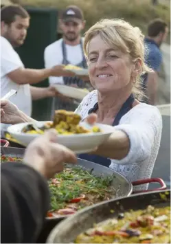  ??  ?? THIS PAGE, FROM LEFT Maggie serves another hungry customer; communal tables are laid with tablecloth­s and simple arrangemen­ts of flowers
OPPOSITE Jemma also sells
cake, drinks and lunches from the Hut: “We don’t spend a penny on advertisin­g and we’ve...