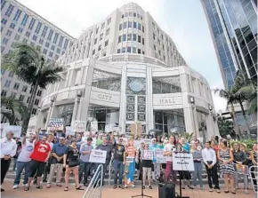  ?? JOE BURBANK/STAFF PHOTOGRAPH­ER ?? A crowd cheers Tuesday at Orlando City Hall as they protest the planned terminatio­n of the federal DACA program. There were protests nationwide to challenge the Trump administra­tion’s move.