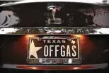  ?? Tom Fox / Dallas Morning News News file photo ?? A driver’s personaliz­ed license plate touts an all-electric Tesla Model S in this photo from 2013.