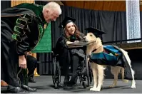  ?? AP ?? Griffin is presented an honorary diploma by Clarkson University president Tony Collins, left, during the Clarkson University “December Recognitio­n Ceremony” in Potsdam. —