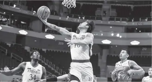  ?? ?? Ateneo de Manila University Blue Eagles’ Dave Ildefonso attempts a reverse layup.