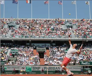  ??  ?? TOUGH ACT: Rafa Nadal serves on his way to victory at Roland Garros last year. The Spaniard will have to fight harder than ever if he is to extend his remarkable run at the French Open.