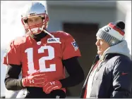  ?? Steven Senne / Associated Press ?? Then-Patriots quarterbac­k Tom Brady, left, and coach Bill Belichick during a practice in 2018.