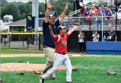  ?? File photo by Jerry Silberman / risportsph­oto.com ?? Coventry Little League coach Lou Simon (left) said he tried to give his New England champions days off this summer, but Sammy Fuentes (right) and the rest of the all-stars continued to work hard on their way to Williamspo­rt, Penn. for the World Seres.