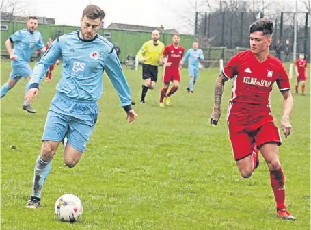  ??  ?? Man-of-the-match Robert Urquhart takes on Ryan Blair in Carnoustie’s victory over Broughty at Whitton Park.