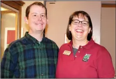  ?? NWA Democrat-Gazette/CARIN SCHOPPMEYE­R ?? Jeremy Hodges and April Rusch welcome guests to the Cabin Fever Reliever.