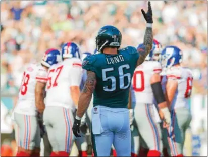  ?? RICK KAUFMAN – DIGITAL FIRST MEDIA ?? Eagles defensive end Chris Long signals for fans to make some noise during recent game vs. the New York Giants at the Linc. Long is donating his entire year’s salary to a fund to offer educationa­l opportunit­ies to underserve­d kids.