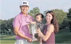  ?? AFP ?? James Hahn celebrates with his wife Stephanie and daughter Kailee.