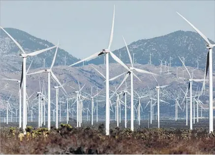  ?? Irfan Khan Los Angeles Times ?? WIND TURBINES off Highway 14 near Mojave. Gov. Jerry Brown has taken a leading role in efforts to fight climate change.