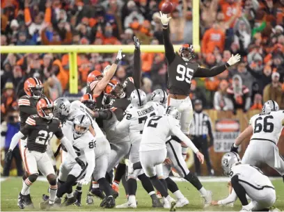  ?? DAVID RICHARD/AP ?? Raiders kicker Daniel Carlson boots the winning 48-yard field goal as time expires Monday in Cleveland.