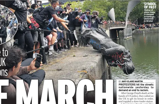  ??  ?? SYMBOL OF PAST Statue of slave trader is dumped in harbour yesterday in Bristol