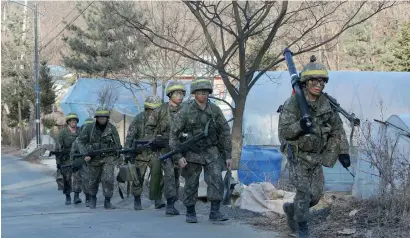  ?? AP ?? South Korean army soldiers conduct the annual exercise in Paju, South Korea, near the border with North Korea, onTuesday. —