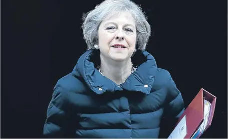  ?? Picture: AP. ?? Prime Minister Theresa May leaves 10 Downing Street to attend Prime Minister’s Questions.