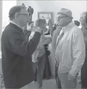  ?? PHOTO BY ANN DAVIDSON ?? Long time movie critic for the Montreal Gazette, John Griffin on right chatting with Peter White during the reception that followed the launch of the 2018 Summer season of activities in TBL. Griffin is working with others to organize a mini-movie...