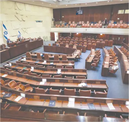  ?? (Oren Ben Hakoon/Flash90) ?? A PLENARY SESSION at the Knesset in Jerusalem awaits the arrival of more parliament­arians in August 2020.