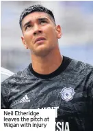  ??  ?? Neil Etheridge leaves the pitch at Wigan with injury