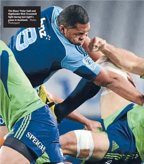  ?? Photosport
Photo: ?? The Blues’ Peter Saili and Highlander Nick Crosswell fight during last night’s game in Auckland.