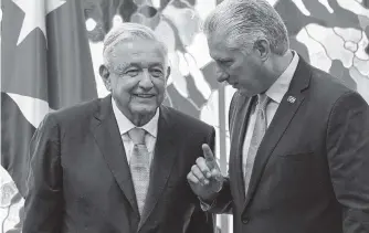  ?? YAMIL LAGE AP ?? Cuban leader Miguel Diaz Canel and Mexican President Andrés Manuel López Obrador signed bilateral agreements in Havana May 8.