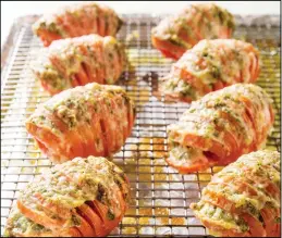  ??  ?? This undated photo provided by America’s Test Kitchen in July 2019 shows Hasselback
Tomatoes in Brookline, Mass. (AP)