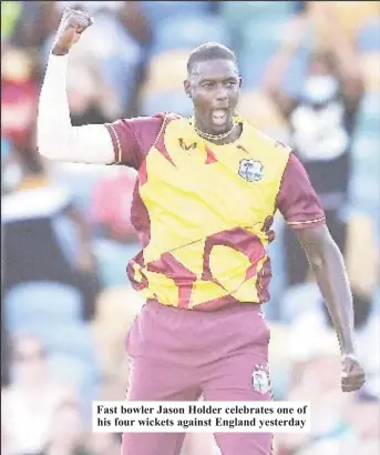  ?? ?? Fast bowler Jason Holder celebrates one of his four wickets against England yesterday